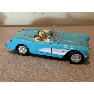 1957 CHEVROLET CORVETTE CONVERTIBLE Teal 1:24 DIECAST Model 93019 Road Legends